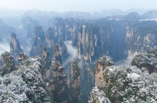 Rime covered rock pillars stretch up to sky in land of 'Avatar'